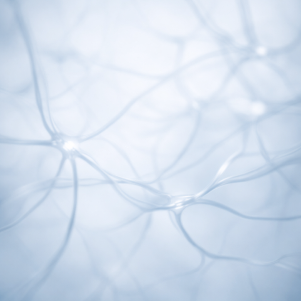 Softly blurred branching structures in a cool blue white palette.